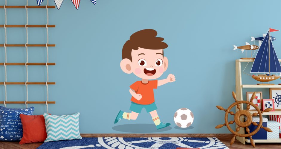 Αυτοκόλλητα Τοίχου - Χαρούμενο παιδάκι που παίζει ποδόσφαιρο