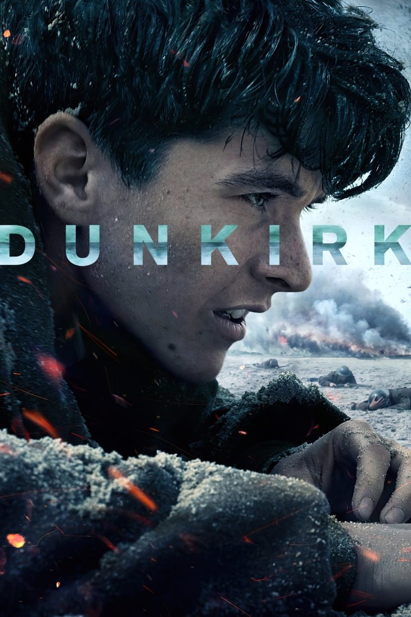 Πόστερ ταινίας Dunkirk – κοντινό νεαρού στρατιώτη στην άμμο, με καπνό από μάχη πάνω από την παραλία — εικόνα 1 από 6